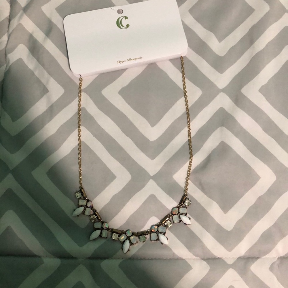 Charming Charlie’s gold necklace with white stones